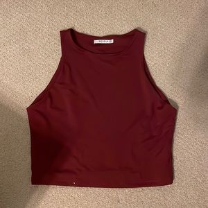 Maroon/red tank top size Large. Tight fit and athletic material.